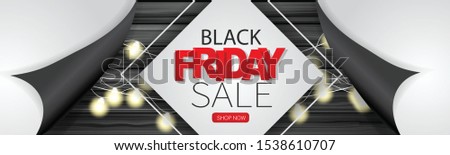 Black Friday Sale banner or long narrow header for website. Design concept for big discount of the year with wooden wall and glowing lights garland under peeling off wrapping paper
