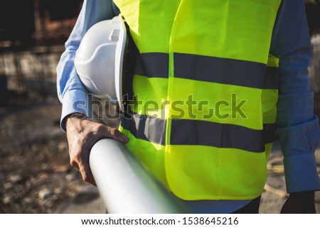 A man construction worker on building site.Stock photo