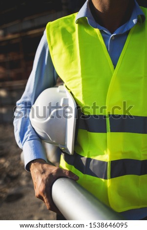 A man construction worker on building site.Stock photo