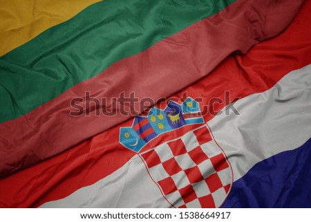 waving colorful flag of croatia and national flag of lithuania. macro