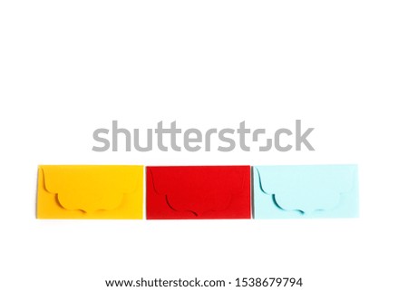 Communication, newsletter and business concept- three colorful envelopes on white background.