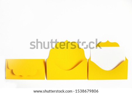 Set of yellow envelopes sealed, empty and with blank paper inside isolated on white background. Communication, newsletter and business concept.