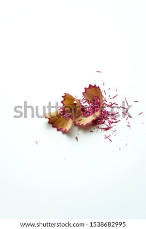 Pink pencil shavings. White background