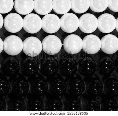 background of black and white pearls symbol of positive and negative