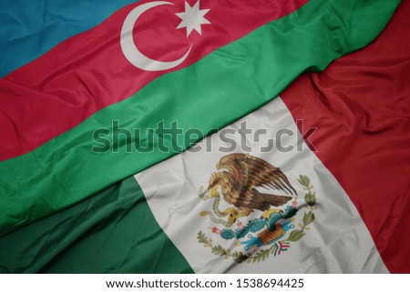 waving colorful flag of mexico and national flag of azerbaijan. macro