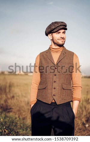 man wearing traditional english clothes outdoors Royalty-Free Stock Photo #1538709392
