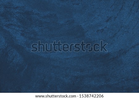 Elegant navy blue colored dark Concrete textured background with roughness and irregularities to your design or product. Color trend concept.
