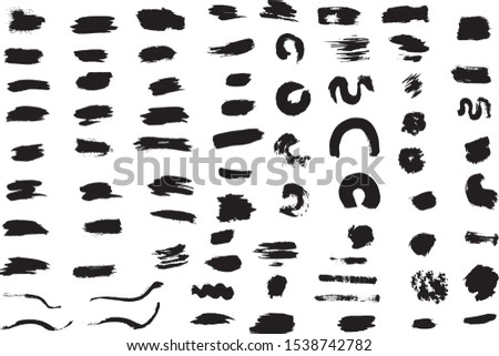 Big set of black brush strokes, spots, strokes on a white background. Ink splatters. Different grunge brush strokes. 