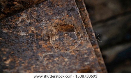 A rusty iron plate due to oxidation from natural changes