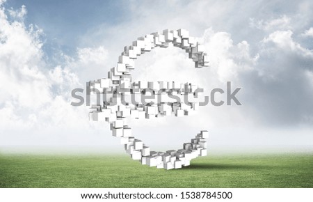 Euro currency sign from cubes on green meadow. Investment and money saving services. Financial company business. Nature landscape with green grass and blue sky. Mixed media with 3D rendering object.