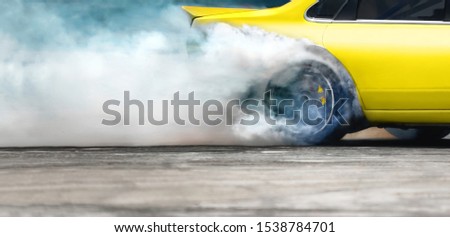 Race drift car burning tires on speed track Royalty-Free Stock Photo #1538784701