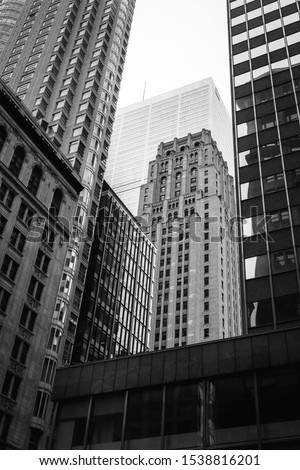 urban photo of buildings in pleasing composition taken at upward angle in black and white.