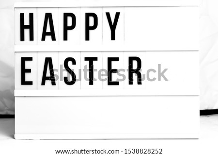 Happy Easter displayed on a vintage Retro Lightbox. Flat Lay Concept image