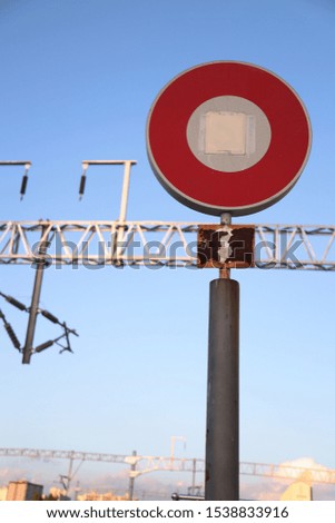 Signs erected on a train station platform.
