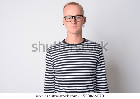Portrait of young handsome blonde man with eyeglasses