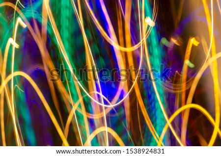 Defocused abstract background image. Drawing with light at low shutter speed. X-mas New year party creative background.