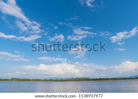 Picture of Mekong River and Blue Sky Border of Thailand and Laos in Chiang Saen,  Landmark of Chiang Rai. Located in Thailand. Picture for Chiang Rai Travel Concept.