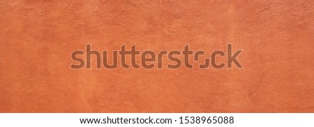 Abstract panorama image of Orange clay wall grunge texture background for interior decoration. Royalty-Free Stock Photo #1538965088