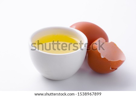 Egg whites in  glass cup on  white background. Royalty-Free Stock Photo #1538967899