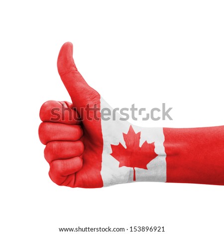 Hand with thumb up, Canada flag painted as symbol of excellence, achievement, good - isolated on white background