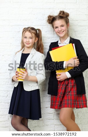 lifestyle people concept: two pretty young school teenage girls having fun happy smiling