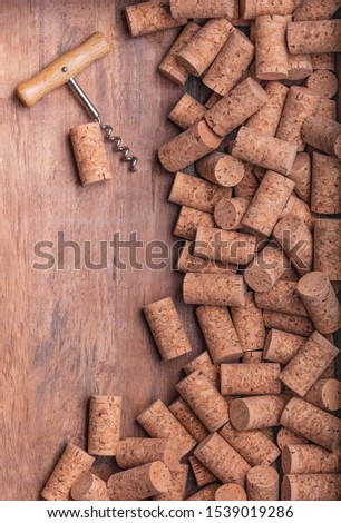 wine opener bottle on corks and wood background Poster concept design photo shooting