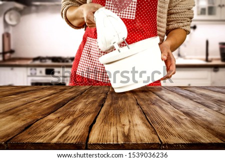 Table background of free space for your decoration and slim young woman making cake. Chrsitmas time. 