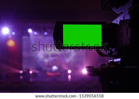 Live concert camera with green screen monitor purple background    