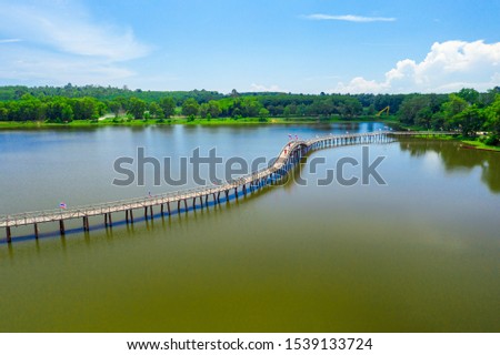 Wood bridge cross the river and blusky with cloud in Chumphon province, Thailand.