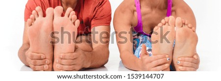 Yoga group concept. Young couple meditating together