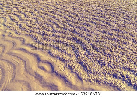 Waves on the sand and gravel nature texture
