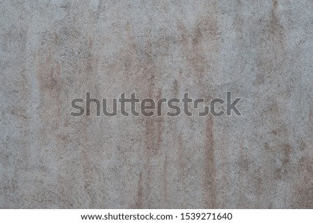 filled frame close up background wallpaper shot of a white grey rough grunge concrete wall forming beautiful patterns and shapes