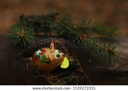 beautiful mouse with cheese looks out of the tree