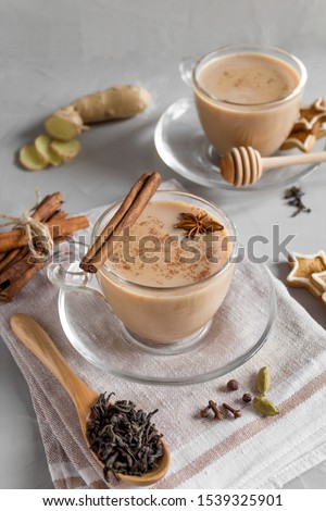 Hot black tea with milk and spices. Traditional Indian drink. Masala tea. Copy space, side View.
