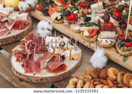 Various foods including meat snacks and cheese and sandwiches.