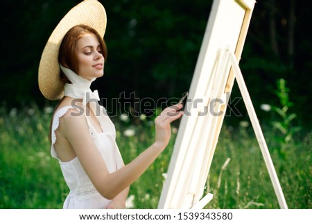 young woman with a beautiful smile in a straw hat