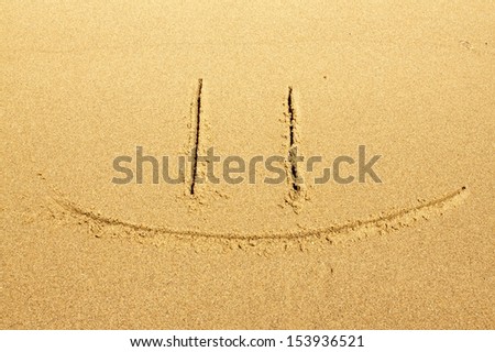 "Smile" drawing at sand