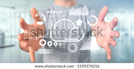 View of Businessman holding Cloud and wifi concept with icon, stats and data 