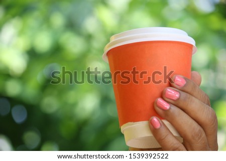 A cup of  hot coffee on the background 