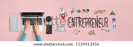 Entrepreneur with person using a laptop computer