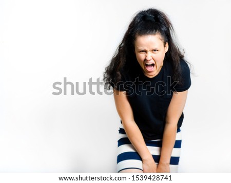 beautiful girl screaming and getting angry isolated on a white background