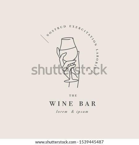 Vector design linear template logo or emblem - female hand holding glass of wine. Abstract symbol for wine bar or sommelier courses Royalty-Free Stock Photo #1539445487