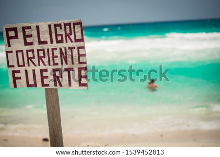Picture taken in cozumel mexico. Translation: "strong current danger"
