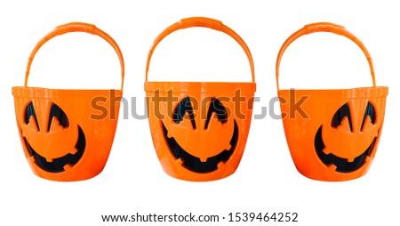 3 pumpkin plastic orange bucket with a smiley face on Halloween decorating concept, white background isolated, work path inside