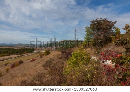 Pictured autumn landscape with a valley among the hills