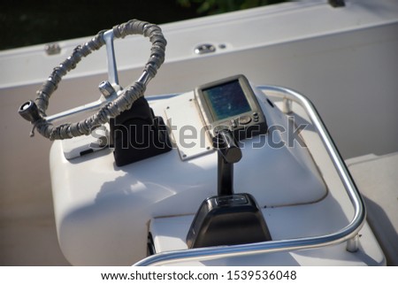 Small leisure boat rudder and instruments Royalty-Free Stock Photo #1539536048