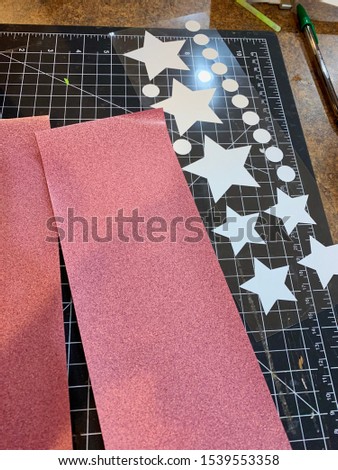 Glitter Heatpress Vinyl  HTV Film Weeding and Cut Material on a Black Cutting Mat
