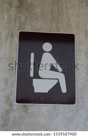toilet symbol in grey background