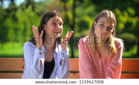Young woman feeling tired of talking friend, communication problem, relations Royalty-Free Stock Photo #1539627008
