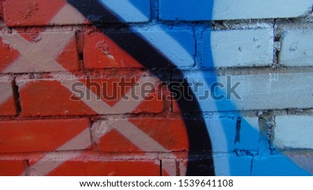 brick wall painted in different bright colors